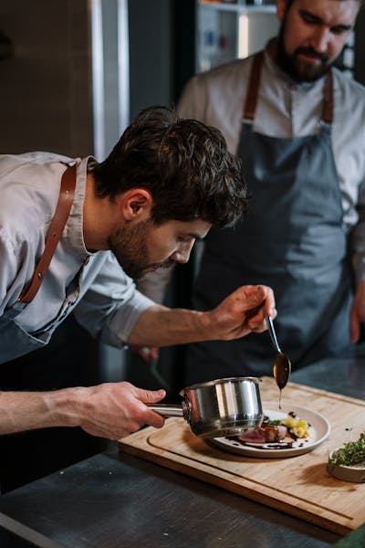 Nordic chef plating an intimate tasting course